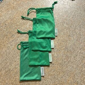 Set of 4 green Knockaround drawstring cloth sunglasses case